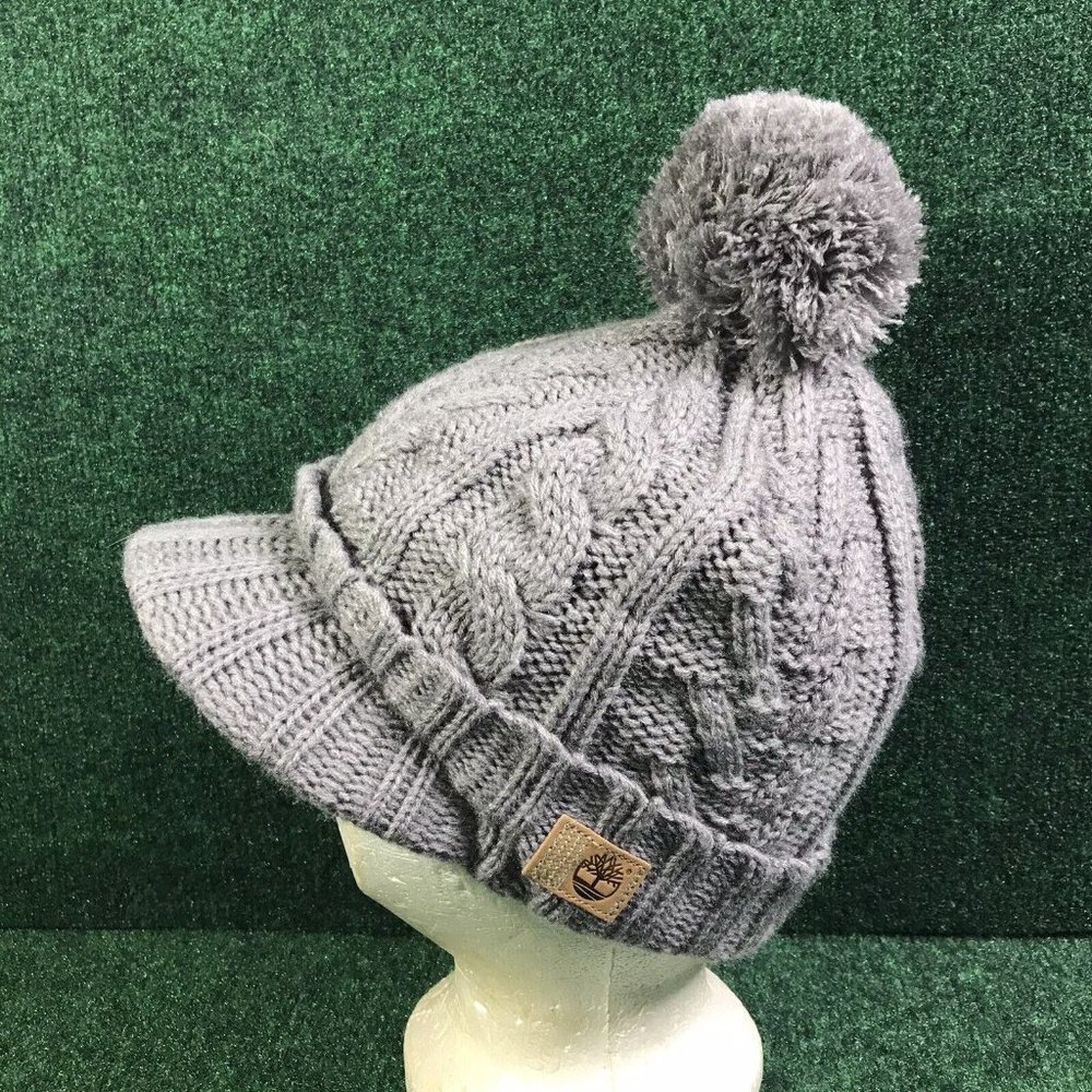 TIMBERLAND CABLE PEAK KNIT LEATHER PATCH LINED BILLED POM BEANIE GRAY ONESIZE